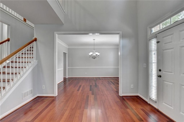 3805 Roxwood Park Dr, Buford, GA 30518 - foyer with hardwood / wood-style flooring, a chandelier, stairway, ornamental molding, and baseboards
