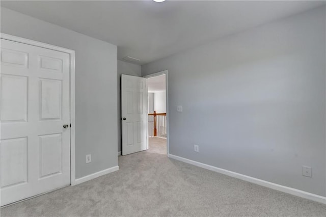 3805 Roxwood Park Dr, Buford, GA 30518 - unfurnished bedroom with light colored carpet and baseboards