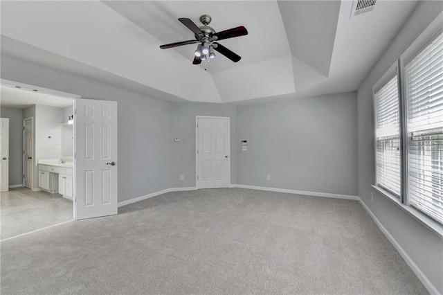 3805 Roxwood Park Dr, Buford, GA 30518 - unfurnished bedroom with light carpet, multiple windows, a raised ceiling, and baseboards