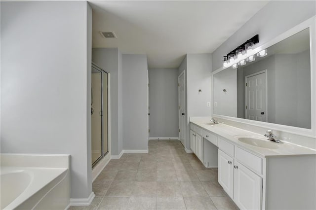3805 Roxwood Park Dr, Buford, GA 30518 - bathroom with a bath, double vanity, a stall shower, baseboards, and tile patterned flooring