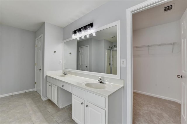 3805 Roxwood Park Dr, Buford, GA 30518 - full bath featuring double vanity, a stall shower, baseboards, and a walk in closet