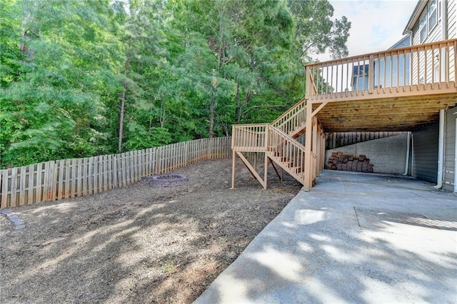 3805 Roxwood Park Dr, Buford, GA 30518 - fenced backyard featuring a wooden deck and stairs