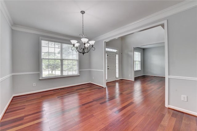 3805 Roxwood Park Dr, Buford, GA 30518 - spare room with a chandelier, ornamental molding, hardwood / wood-style flooring, and baseboards