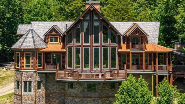 rear view of property with a balcony