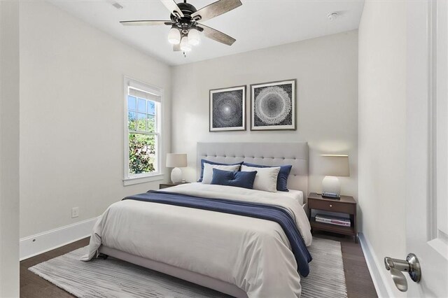 bedroom featuring ceiling fan and wood-type flooring