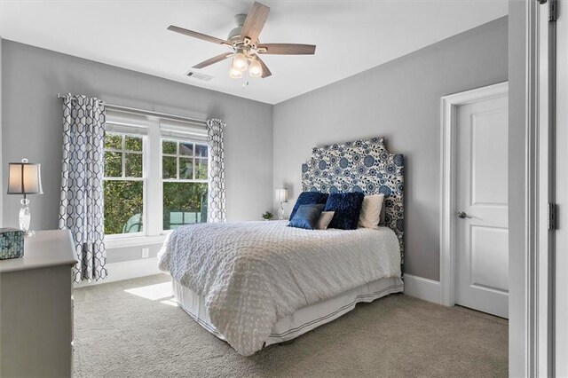 bedroom with ceiling fan and carpet flooring