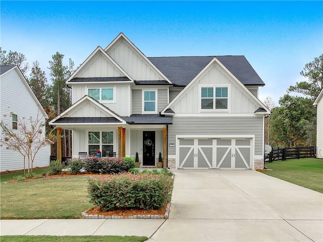 craftsman-style home with a garage and a front lawn