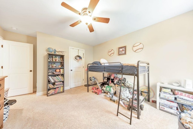 bedroom featuring light carpet and ceiling fan