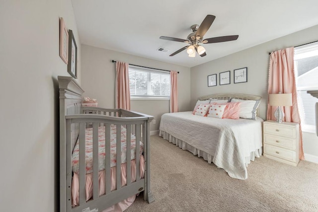 carpeted bedroom with ceiling fan