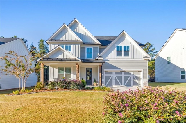 view of front of house featuring a garage and a front yard