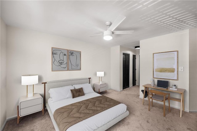3655 Habersham Rd NE Unit 203, Atlanta, GA 30305 - bedroom featuring carpet flooring, baseboards, a closet, and a ceiling fan