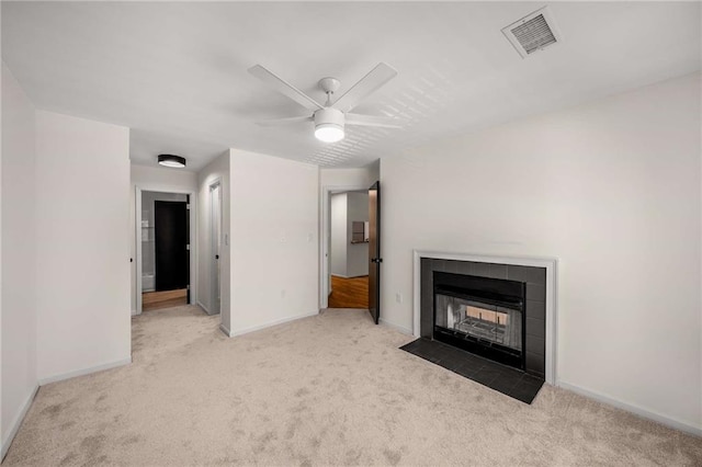 3655 Habersham Rd NE Unit 203, Atlanta, GA 30305 - unfurnished living room with carpet flooring, baseboards, ceiling fan, and a tile fireplace