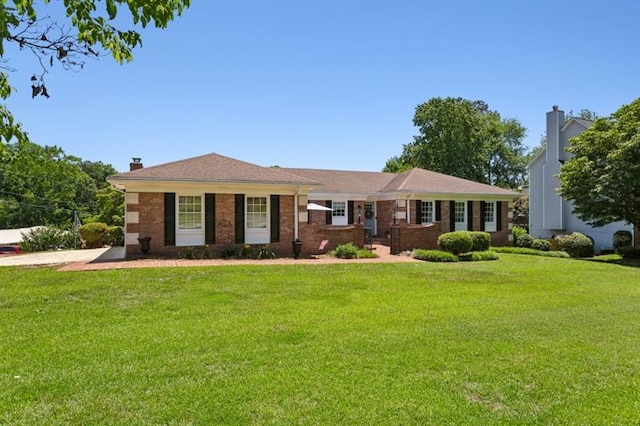 ranch-style home with a front yard