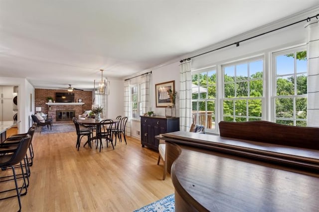 living room with a fireplace and light hardwood / wood-style floors