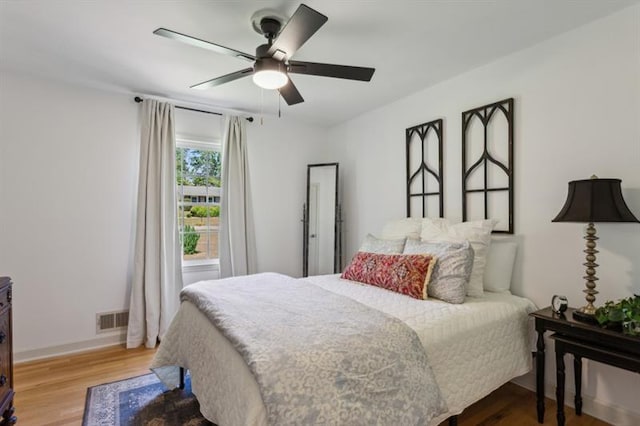 bedroom featuring hardwood / wood-style floors and ceiling fan