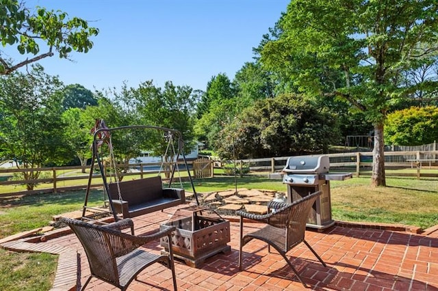 view of patio featuring a grill