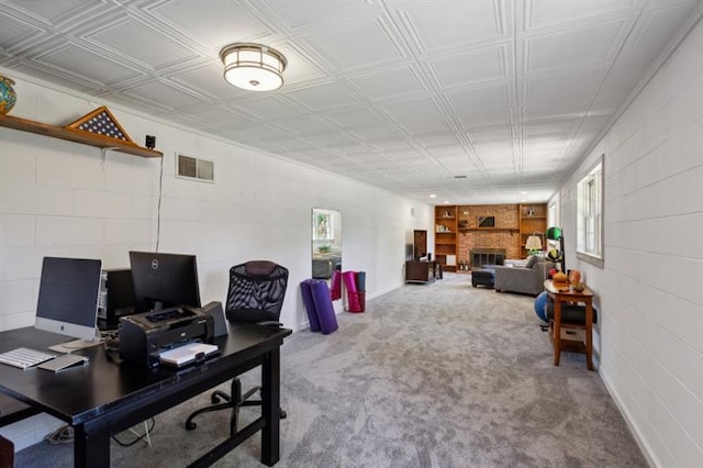 home office featuring carpet floors and a large fireplace