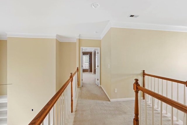 hallway with light colored carpet and ornamental molding