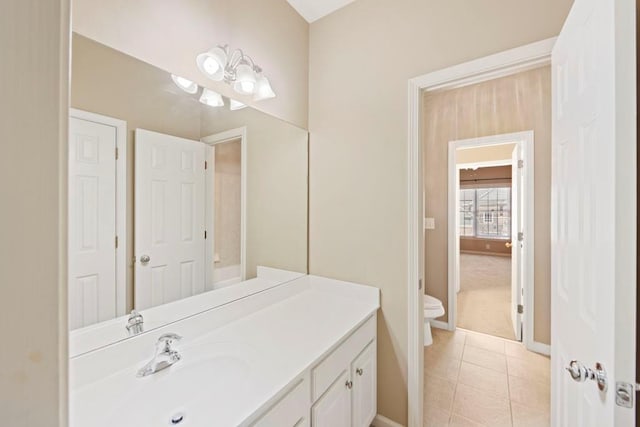 bathroom featuring tile patterned flooring, vanity, and toilet