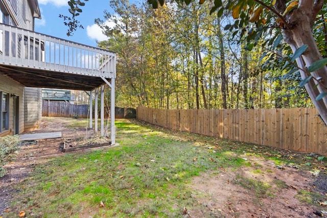 view of yard with a wooden deck