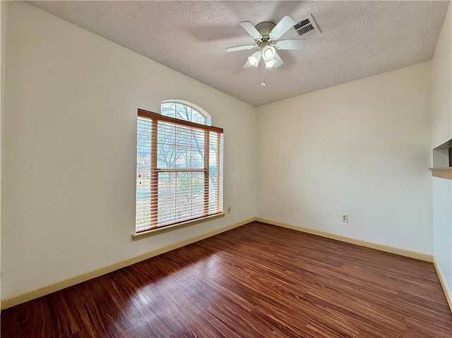 unfurnished room with hardwood / wood-style floors, a textured ceiling, and ceiling fan