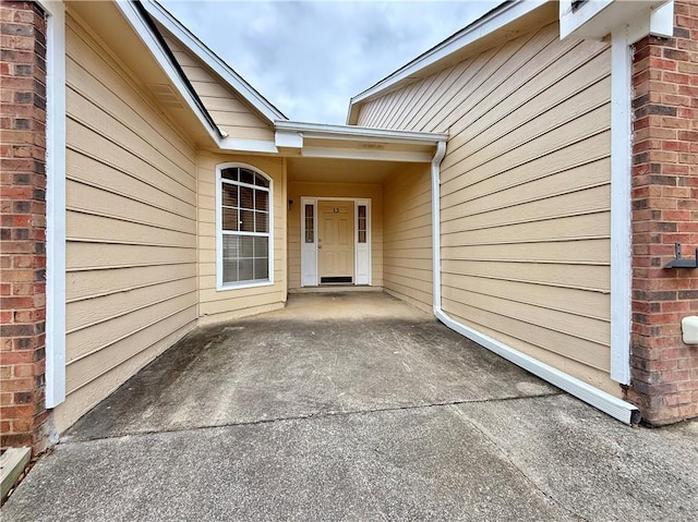 doorway to property with a patio