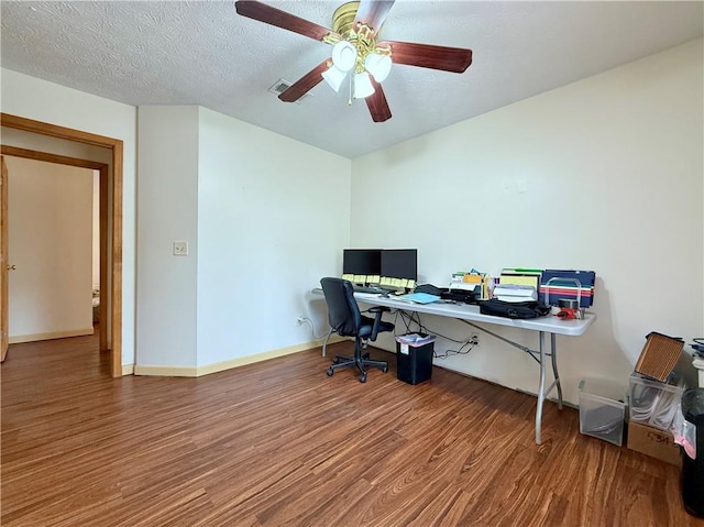 office area with ceiling fan, hardwood / wood-style floors, and a textured ceiling