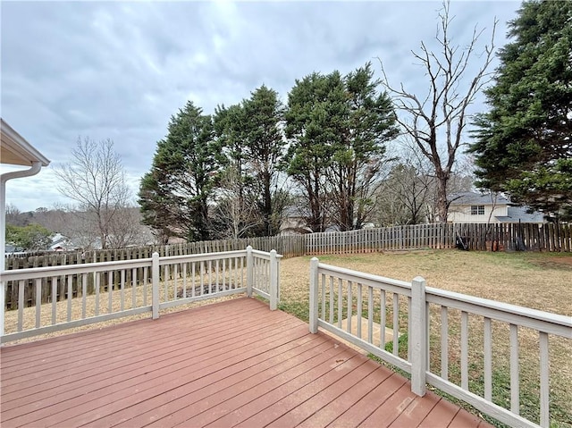 wooden deck featuring a yard