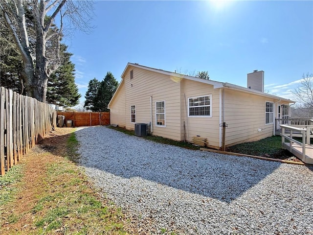 view of side of property featuring central AC