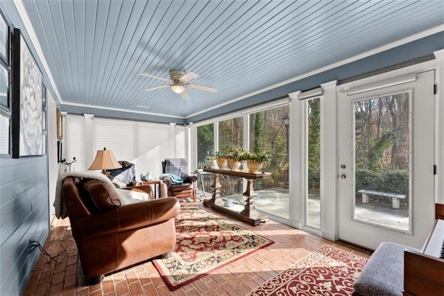 sunroom with ceiling fan and wood ceiling