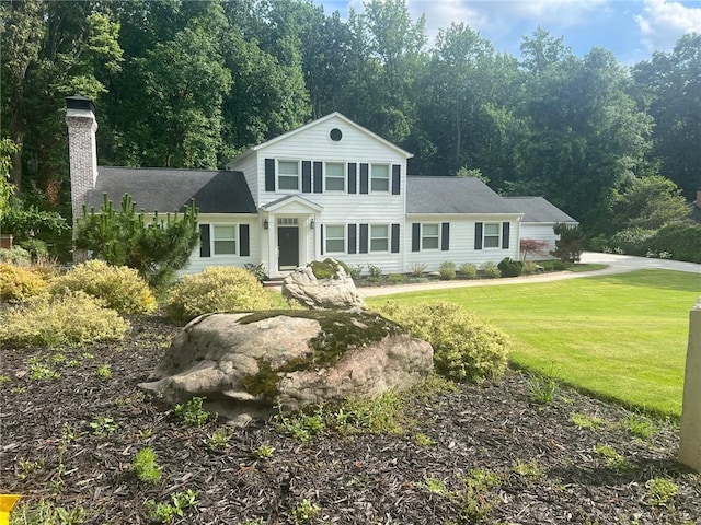 669 Dixon Dr, Gainesville, GA 30501 - traditional-style home with a chimney and a front yard