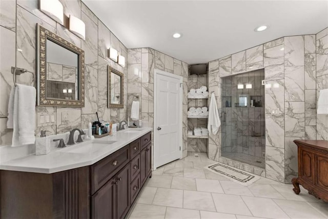 669 Dixon Dr, Gainesville, GA 30501 - bathroom featuring tile walls, double vanity, a shower with shower door, and recessed lighting