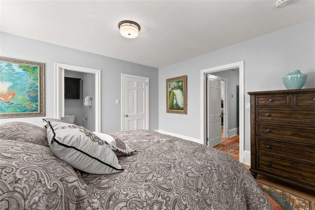 bedroom featuring baseboards