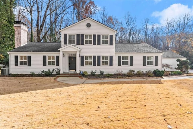 669 Dixon Dr, Gainesville, GA 30501 - neoclassical home with a chimney, cooling unit, and roof with shingles
