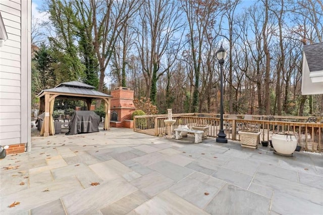 view of patio / terrace with a gazebo and a fireplace