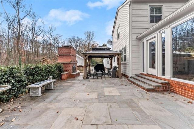 view of patio featuring entry steps and a gazebo