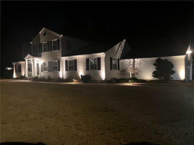 view of front of home with a yard