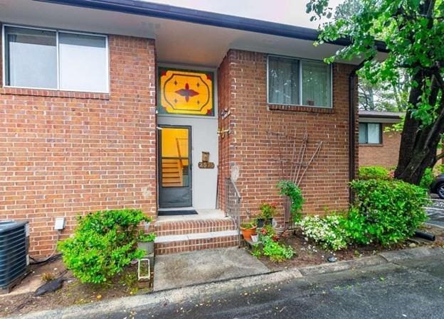 property entrance with central AC unit