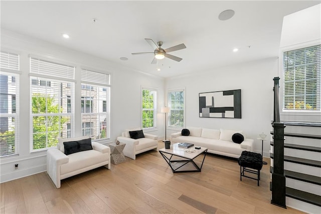 living room featuring recessed lighting, light wood-type flooring, baseboards, and ceiling fan