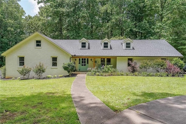 527 Gaddis Rd, Canton, GA 30115 - cape cod house featuring brick siding, a front yard, and a shingled roof