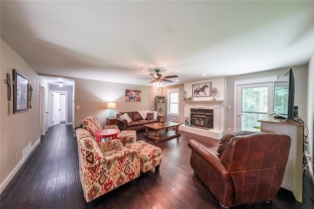 527 Gaddis Rd, Canton, GA 30115 - living room featuring dark wood-style flooring, ceiling fan, and a brick fireplace