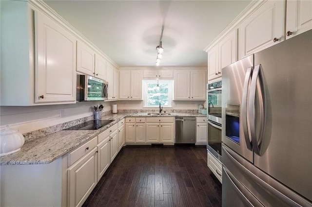 527 Gaddis Rd, Canton, GA 30115 - kitchen featuring stainless steel appliances, white cabinets, dark wood-style flooring, and light stone counters