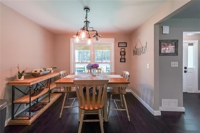 527 Gaddis Rd, Canton, GA 30115 - dining space with dark wood-style floors and a chandelier