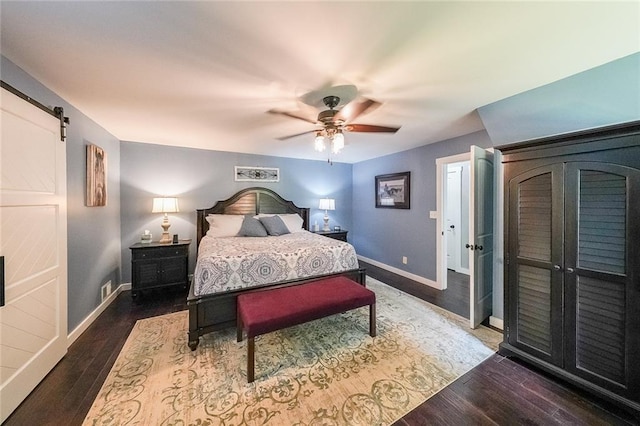 527 Gaddis Rd, Canton, GA 30115 - bedroom with wood finished floors, a barn door, and ceiling fan