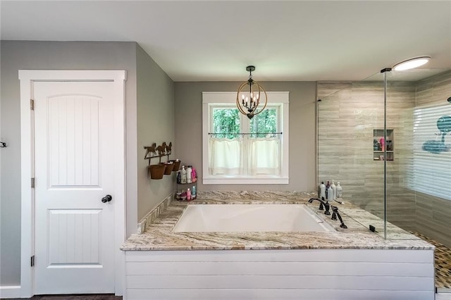 527 Gaddis Rd, Canton, GA 30115 - full bath featuring a garden tub, a chandelier, and a tile shower
