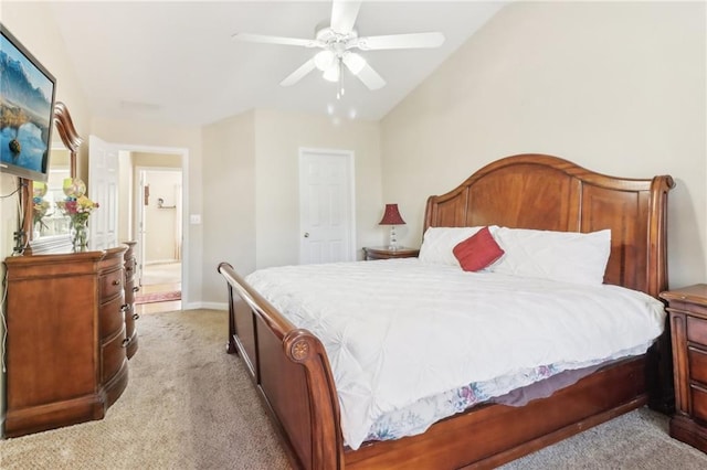 bedroom with vaulted ceiling, light carpet, and ceiling fan