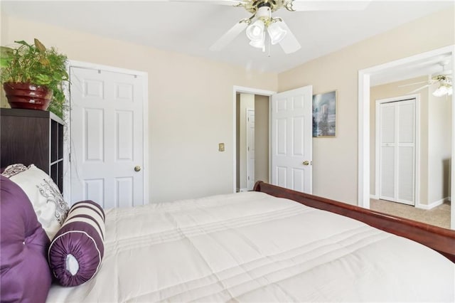 bedroom featuring ceiling fan and carpet