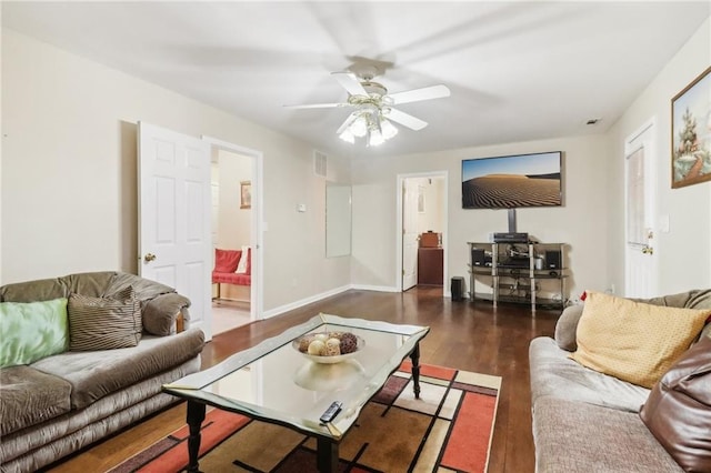 living room with ceiling fan and dark hardwood / wood-style floors