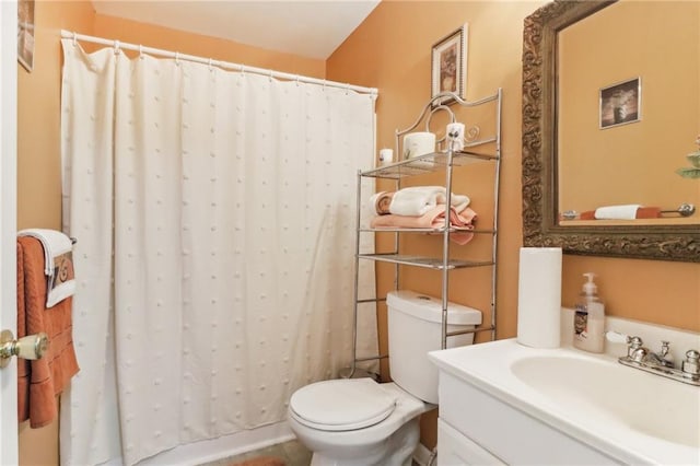 bathroom featuring vanity, a shower with curtain, and toilet