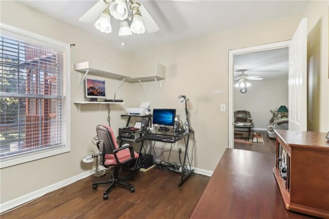 office area with dark wood-type flooring and ceiling fan